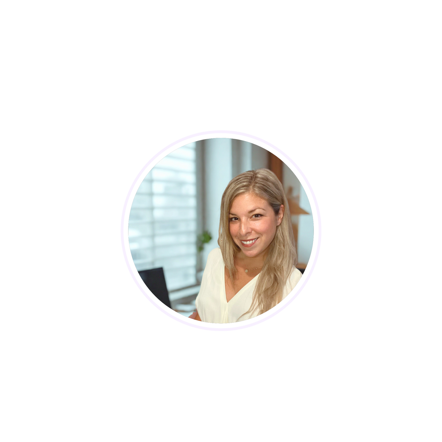 Woman with blonde hair smiling in an office setting